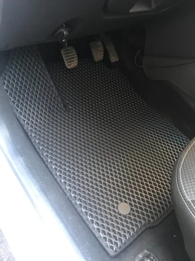 Black EVA interior mats fitted in a Renault Logan